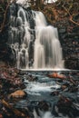 Vertical shot of a scenic waterfall in Mountain Ash, South Wales Royalty Free Stock Photo