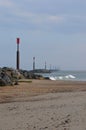 Vertical shot of Sea Palling Beach against a cloudy sky