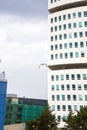 Vertical shot of a seagull flying by the Turning Torso building in Malmo, Sweden Royalty Free Stock Photo