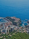 Vertical shot of a seascape of the port in Monaco city with residential buildings on the shore