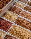 Vertical shot of a selection of dried nuts displayed on a market stall