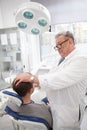 Senior dentist working at his clini Royalty Free Stock Photo