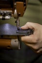 Vertical Shot of Sewing a Complete Box Stitch on Black Leather Royalty Free Stock Photo