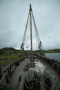 Vertical shot of a ship with ropes and fishing equipment by Lake Sevan Royalty Free Stock Photo