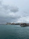 Vertical shot of ships the beach of Kadikoy, the city of Istanbul on a cloudy day