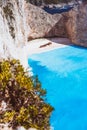 Vertical shot of shipwreck on Navagio beach with turquoise blue sea water surrounded by huge white cliffs. Famous Royalty Free Stock Photo