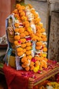 Vertical shot of the Shiva god with Hindu religoius flowers offering