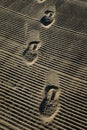 Vertical shot shoeprints on the sand