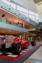 Vertical shot at side of a vintage Ferrari F1 Championship car inside of Maremagnum Shopping mall Royalty Free Stock Photo