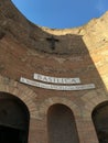 Vertical shot of the sign on the entrance: The Basilica of St. Mary of the Angels and of the Martyrs