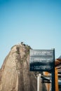 Vertical shot of a sign post showing directions in Rio de Janeiro