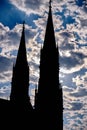 Vertical shot of a silhouette of a church touching the sky