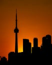 Vertical shot of the silhouette of the CN Tower during the golden sunset in Toronto, Canada Royalty Free Stock Photo