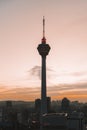 Vertical shot of the silhouette of Menara Tower in Kuala Lumpur during the sunset