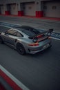 Vertical shot of a silver Porsche on the track, Dubai Royalty Free Stock Photo