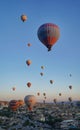 Vertical shot of a sky filled with hot air balloons over Cappadocia, Turkey at sunrise Royalty Free Stock Photo