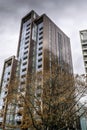 Vertical shot of a skyscraper against the cloudy sky in Wandsworth, London Royalty Free Stock Photo