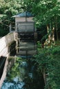 Vertical shot of a small water pond outdoors in Schwabing, Munich, Germany in daylight