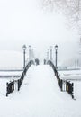 Vertical shot of a snow-covered pedestrian bridge Royalty Free Stock Photo