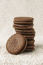 Vertical shot of some delicious chocolate filled Oreos on a white background