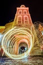 Vertical shot of spinning light effects in the street