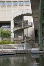 Vertical shot of spiral stairs in front of a concrete building in Montreal Royalty Free Stock Photo