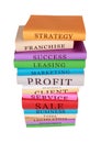 Vertical shot of a stack of colorful business books isolated on a white background