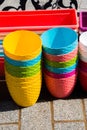 Vertical shot of a stack of colorful plastic pots Royalty Free Stock Photo