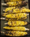 Vertical shot of a stack of grilled corns