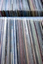 Vertical shot of a stack of old used vinyl records in covers Royalty Free Stock Photo