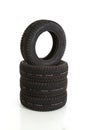 Vertical shot of a stack of rubber tires isolated on a white background Royalty Free Stock Photo