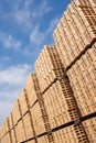 Vertical shot of a stack of wooden pallets in a warehouse cargo storage Royalty Free Stock Photo