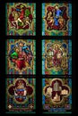 Vertical shot of stained glass window of the Cologne Cathedral with religious paintings, Germany