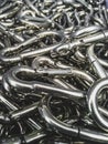 Vertical shot of stainless steel carabiners in a bunch
