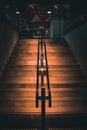 Vertical shot of stairs inside a cafe illuminated by lights