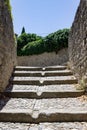 Vertical shot of stairs inside the the medieval fortified city of Carcassonne, south France Royalty Free Stock Photo