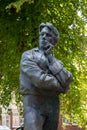 Vertical shot of the statue of the famous WW1 poet Rupert Brooke in a park in Rugby, United Kingdom