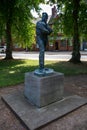 Vertical shot of the statue of the famous WW1 poet Rupert Brooke in a park in Rugby, United Kingdom