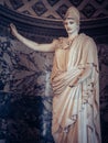 Vertical shot of the statue of a Greek God Athena, Louvre, Paris