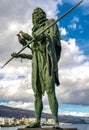 Vertical shot of statue of Guanche king Mencey Anaterve on the waterfront in Canary Islands, Spain