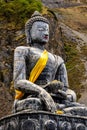 Vertical shot of a statue of The Holy Tibetan Buddha shrine of Muktinath Upper Mustang, Nepal