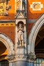 Vertical shot of a statue on one of the walls of the Rijksmuseum