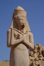 Vertical shot of Statue of Ramesses II against blue sky background in Egypt
