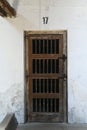 Vertical shot of a steel door with a number 17 on top used during Nazi concentration camp