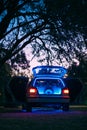 Vertical shot of stereo and speakers in an illuminated interior of a car during sunset Royalty Free Stock Photo