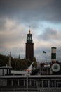 Vertical shot of the Stockholm City Hall Tower under a dark sky in Sweden Royalty Free Stock Photo