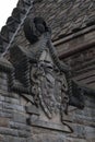 Vertical shot of a stone emblem from William Wallace building at Scottish village