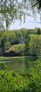 Vertical shot of the Stourhead park temple flora Royalty Free Stock Photo