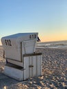 Vertical shot of a strandkorb beach basket (chair) on the seafront on the island of Sylt, Germany Royalty Free Stock Photo