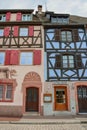 Vertical shot of a street in Colmar, Alsace with typical colorful houses in France Royalty Free Stock Photo